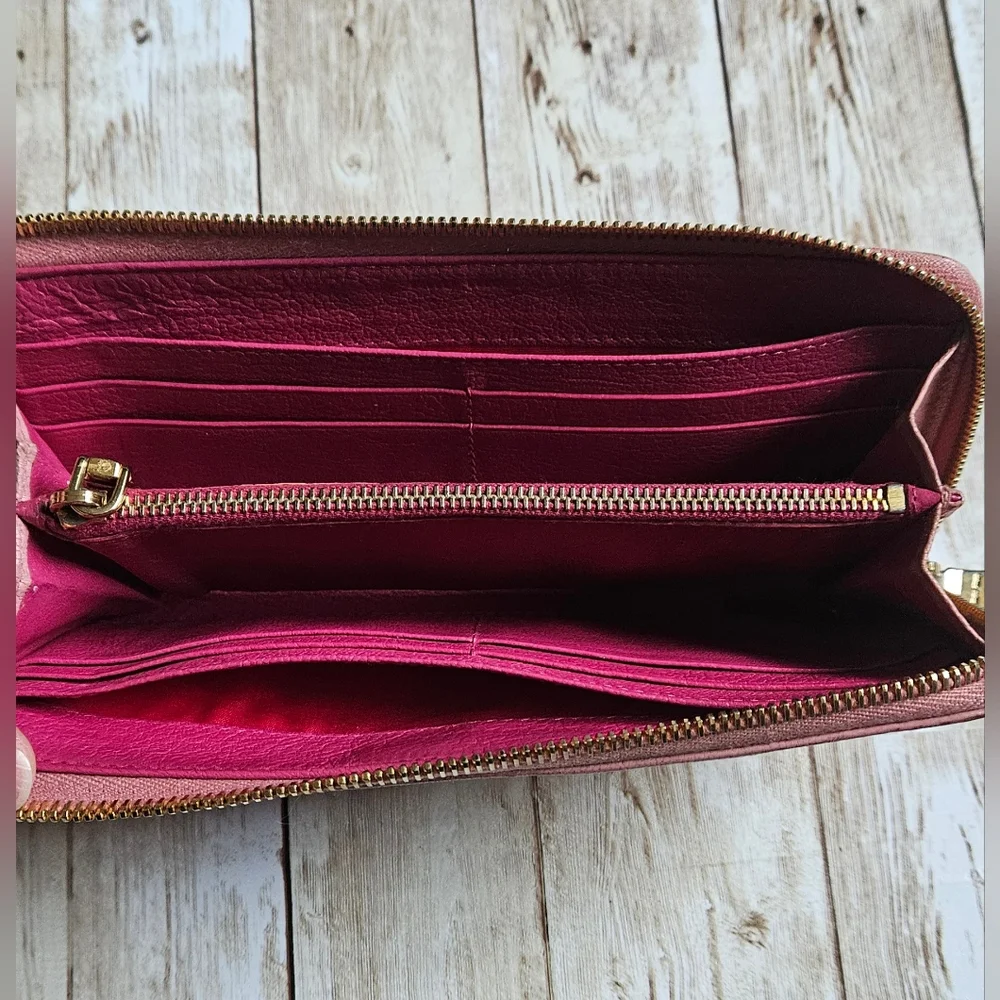 Miu Miu Pink Wallet with Elegant Zip Closure